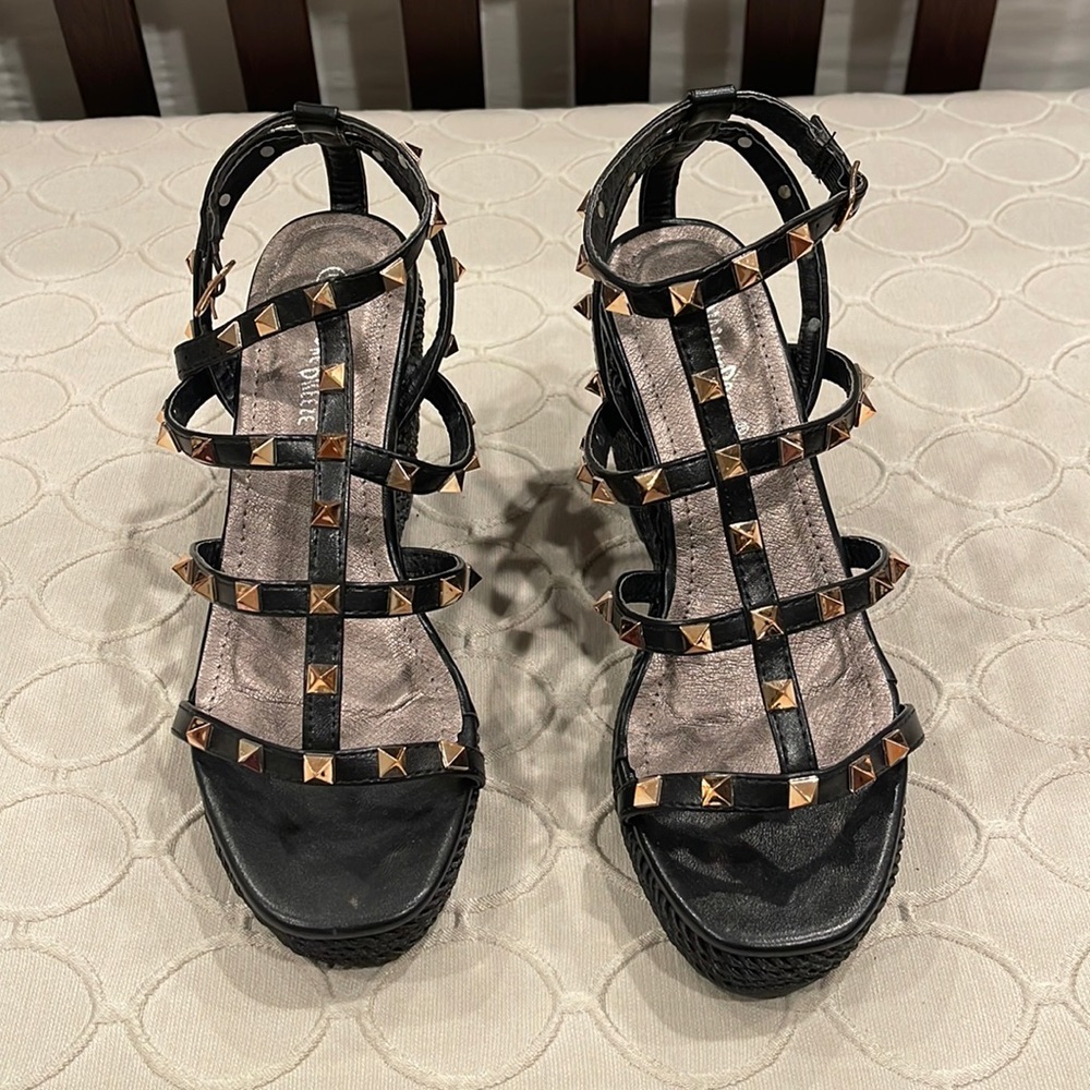 Never worn. Wedges with gold spikes.